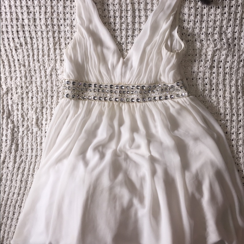 Knee length white formal dress